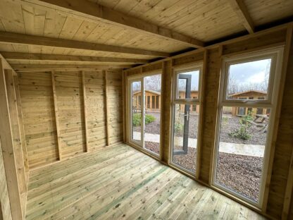this shows the inside of a timber summerhouse